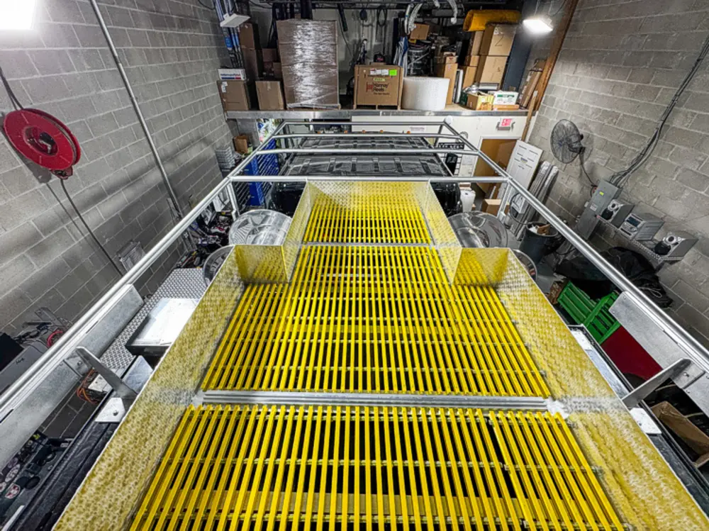 Apparatus in production bay with hood open, photo 61 of 303.